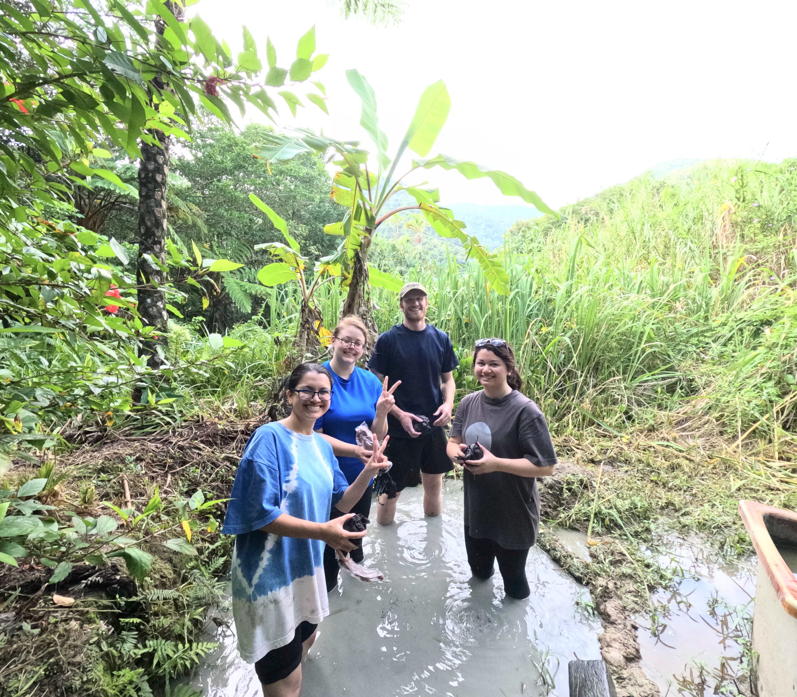 Participants try Dorozome in a mud field.