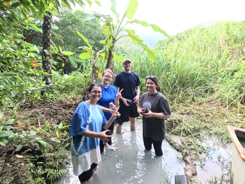 People are trying the dyeing in the mud field.