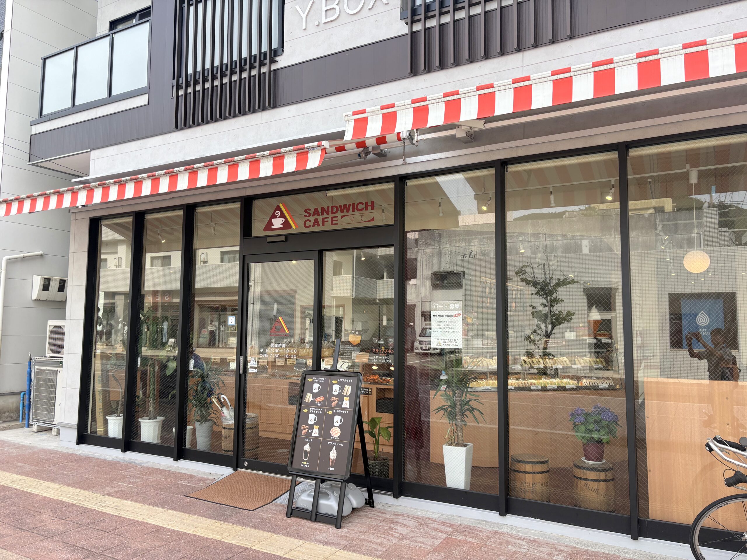 Exterior of a sandwich café in Naze, Amami Oshima with red and white awning