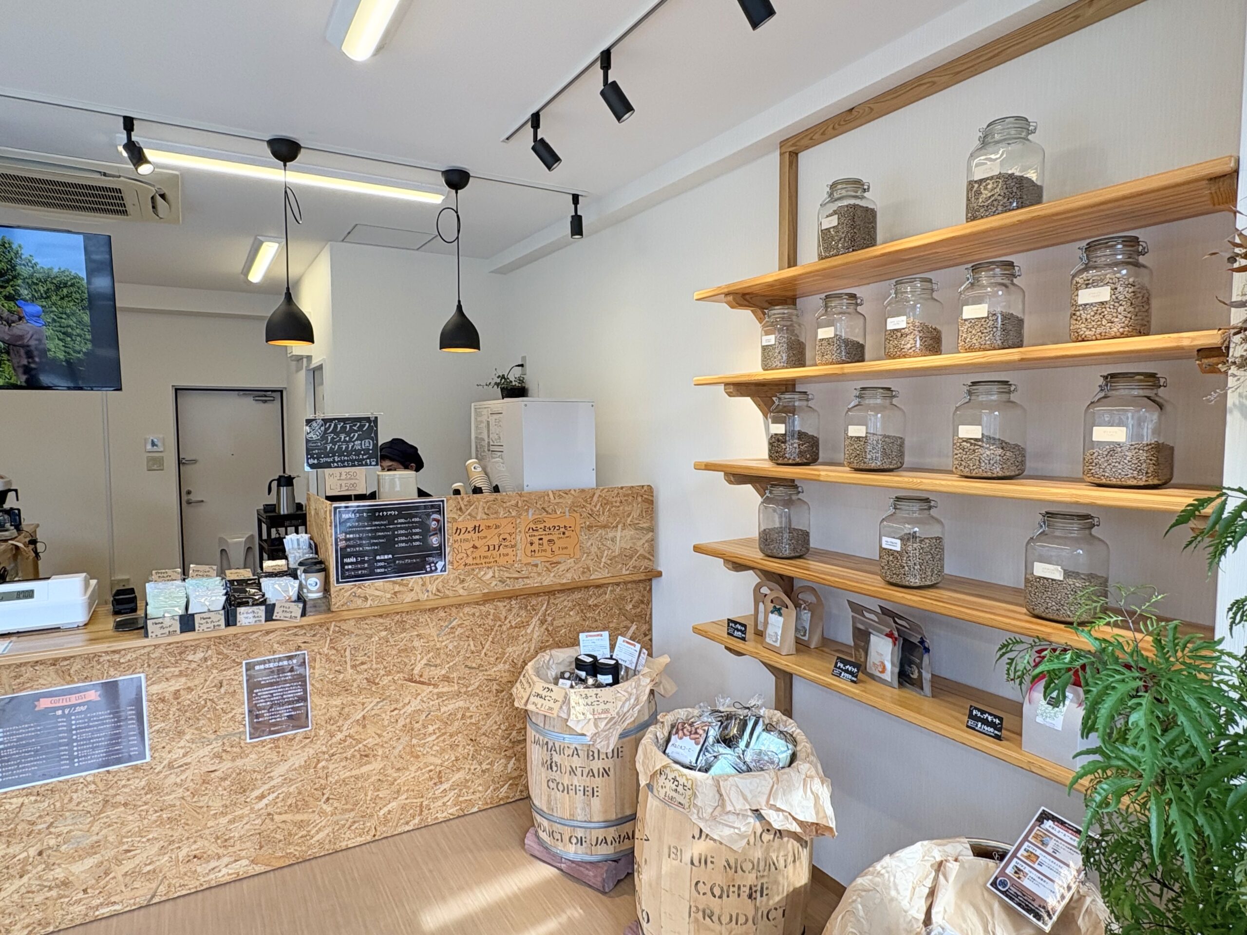 Interior of a specialty coffee shop in Amami Oshima with coffee beans in glass jars