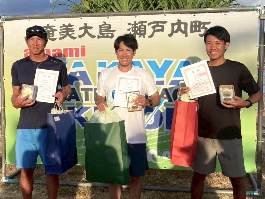 Top 3 surfski finishers at the Amami Seakayak Marathon posing with awards and certificates