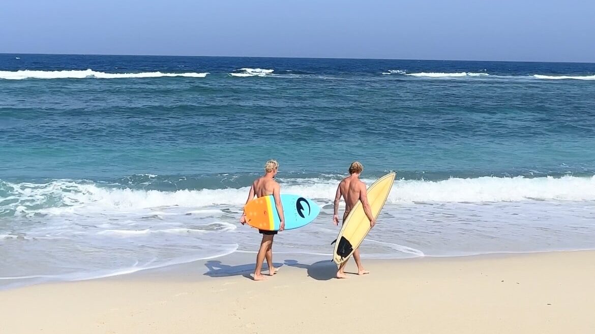 Surfing at a quiet tropical beach on Amami Oshima