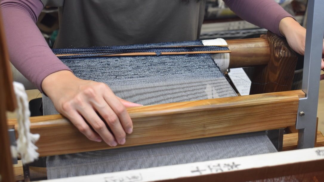 Traditional Oshima Tsumugi weaving experience with local artisans on Amami Oshima